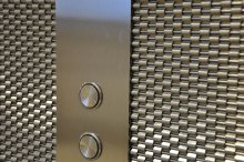 After consulting with Banker Wire, designers selected DS-1 woven wire mesh for the space.
