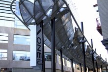 The 20-by-125 foot shade structure, formed by stainless steel wire mesh, provides a beautiful and comfortable place for visitors to ONE City Plaza to relax. 