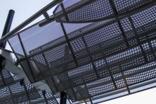 Banker Wire S-12 has a low percent open area, which means it can provide shade without blocking light out entirely. 